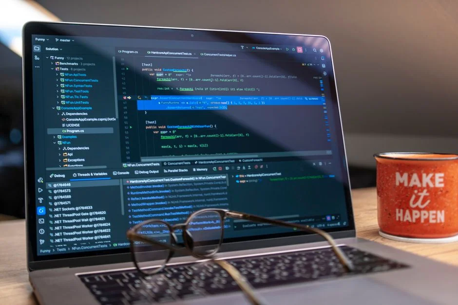 A modern computer screen displaying web design work, showcasing creative visuals in a workspace.
